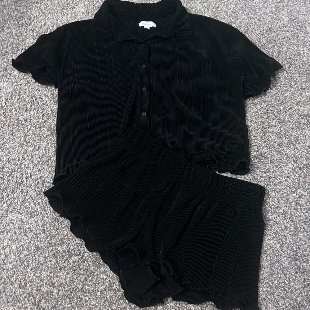 Black ribbed PJ set.
Short sleeved shirt
Shorts